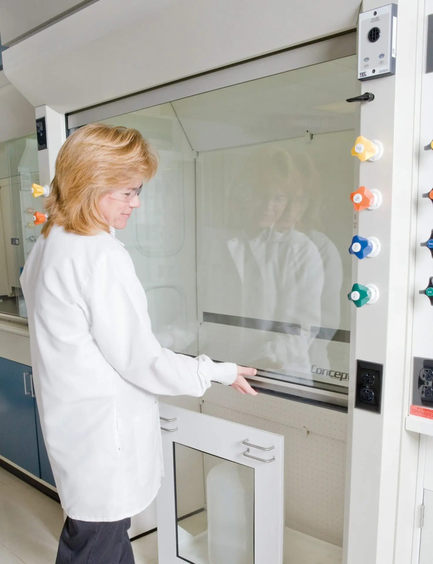Scientist Using Fume Hood Scientist Using Fume Hood
